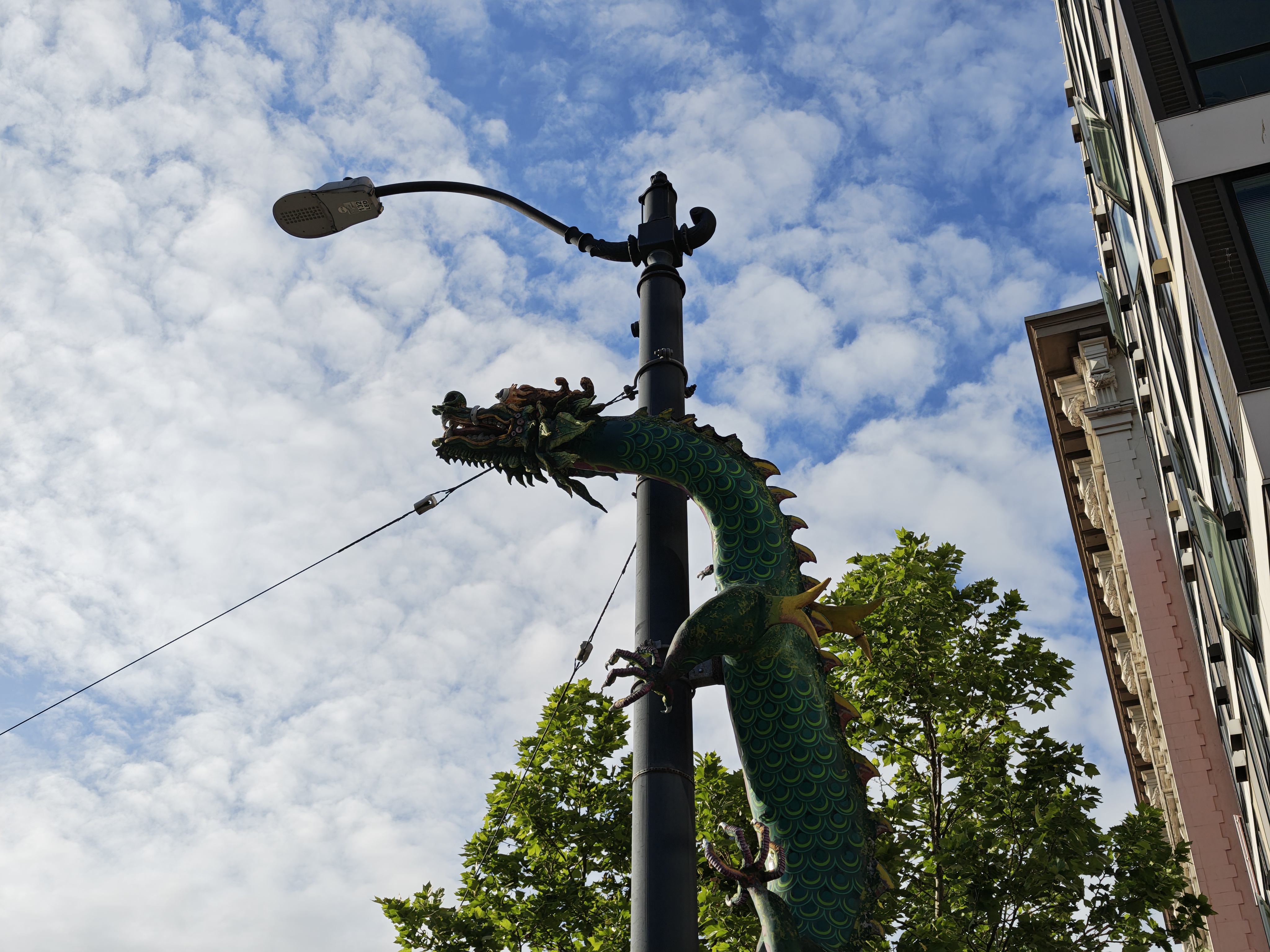 A dragon statue on a light pole