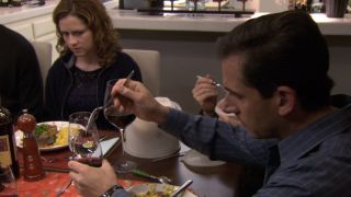 Michael dipping his meat in wine in The Office