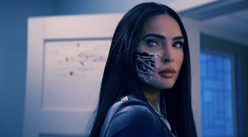 Megan Fox as an android in Subservience with wiring exposed on her cheek