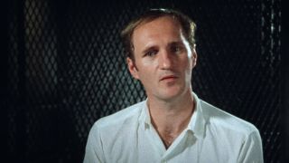 A man in a white shirt being interviewed in The Thin Blue Line