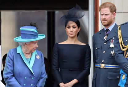 LONDON, ENGLAND - JULY 10: Queen Elizabeth II, Prince Harry, Duke of Sussex and Meghan, Duchess of Sussex on the balcony of Buckingham Palace as the Royal family attend events to mark the Centenary of the RAF on July 10, 2018 in London, England. (Photo by Chris Jackson/Getty Images)