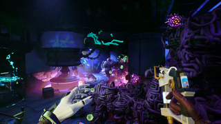 The player moves through a futuristic level with neon glowing lights