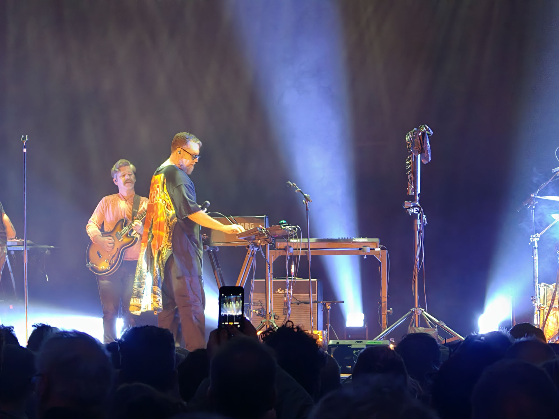 A photo of John Grant playing live.