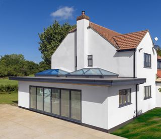 an extension with two roof lanterns on the flat roof