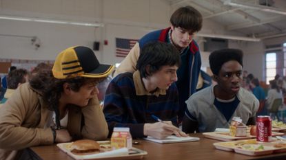 Gaten Matarazzo as Dustin Henderson, Finn Wolfhard as Mike Wheeler, Noah Schnapp as Will Byers, and Caleb McLaughlin as Lucas Sinclair in Stranger Things: Season 5