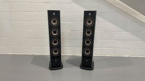 Focal Aria Evo X No3 floorstanding speakers on grey floor close to white brick wall