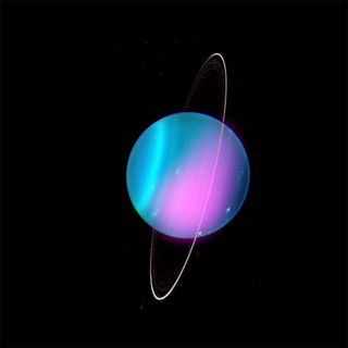 A composite image of the planet Uranus shows 2002 X-ray emission in pinkish purple.