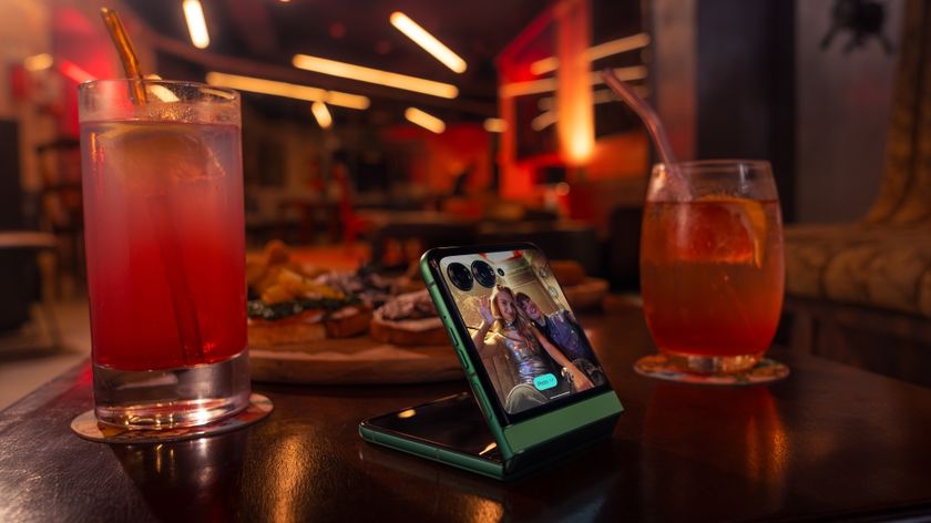 Razr 2025 on a table in between two cocktail glasses