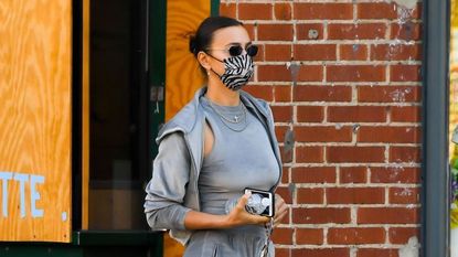 Irina Shayk Paired a Velour Tracksuit With Knee-High Stiletto Boots