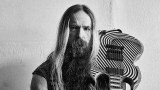 Zakk Wylde with guitar, studio portrait
