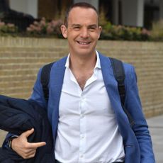 journalist martin lewis with blue coat and white shirt