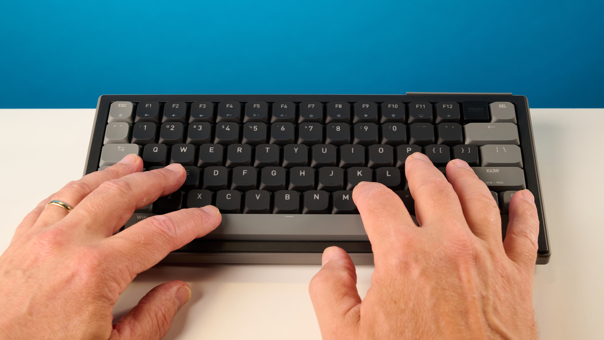 A black Cherry XTRFY K63W Pro Compact mechanical gaming keyboard