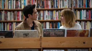 Harriet and her new love interest stare intently at each other in a record store in The Greatest Hits movie