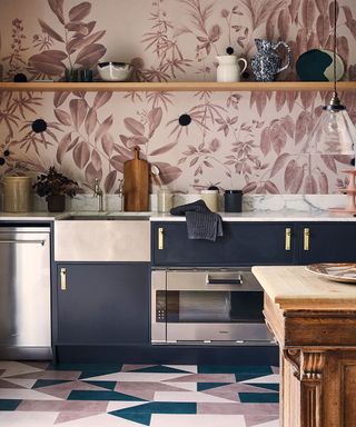 Picture of a kitchen with statement wall mural in earthy tones and dark blue painted cabinetry.