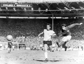Geoff Hurst scores for England against West Germany in the 1966 World Cup final at Wembley.