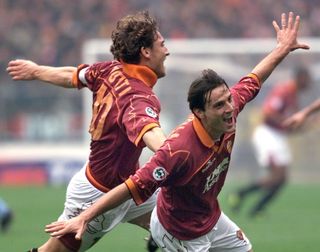 Vincenzo Montella celebrates with Francesco Totti after scoring for Roma against Lazio in November 1999.