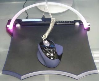 The Aura mouse pad also has a cable arch that lifts the mouse cord five inches above the pad to prevent interference with the mouse's movement.
