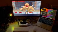 A screenshot from a YouTube video of Doom running on an Apple Lightning to HDMI adapter, with a monitor showing an imp on screen.