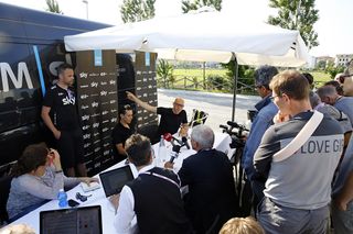 David Brailsford welcomes the journalists a peek inside Porte's motorhome