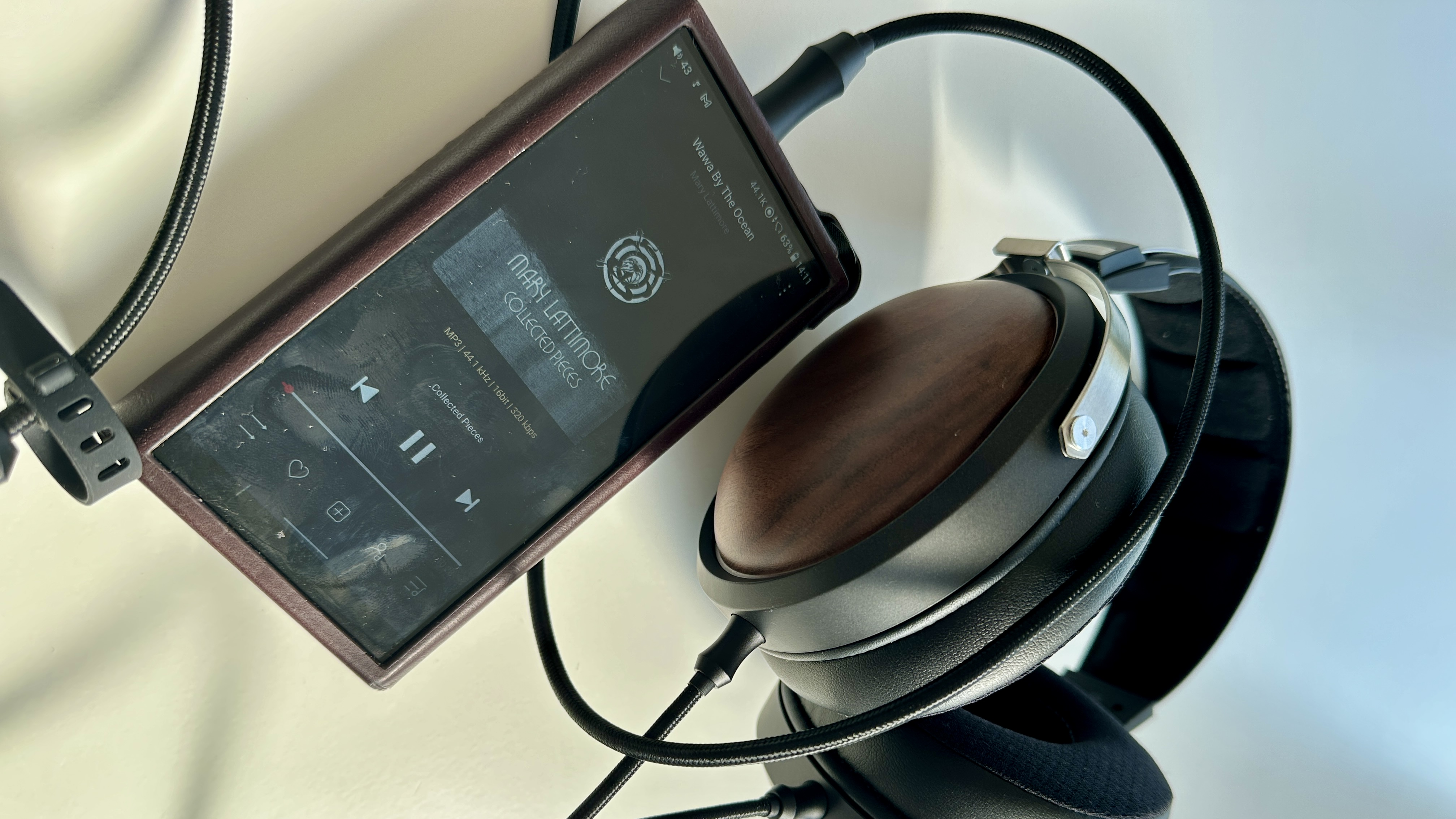 FiiO FT1 over-ear hedphones playing music from from a portable music player