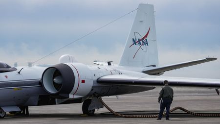 Photograph of the WB-57 jet on a runway being prepper for take off