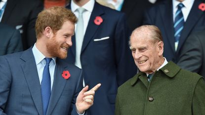 Prince Harry and Prince Philip, Duke of Edinburgh attend the 2015 Rugby World Cup Final match between New Zealand and Australia at Twickenham Stadium on October 31, 2015 in London, England