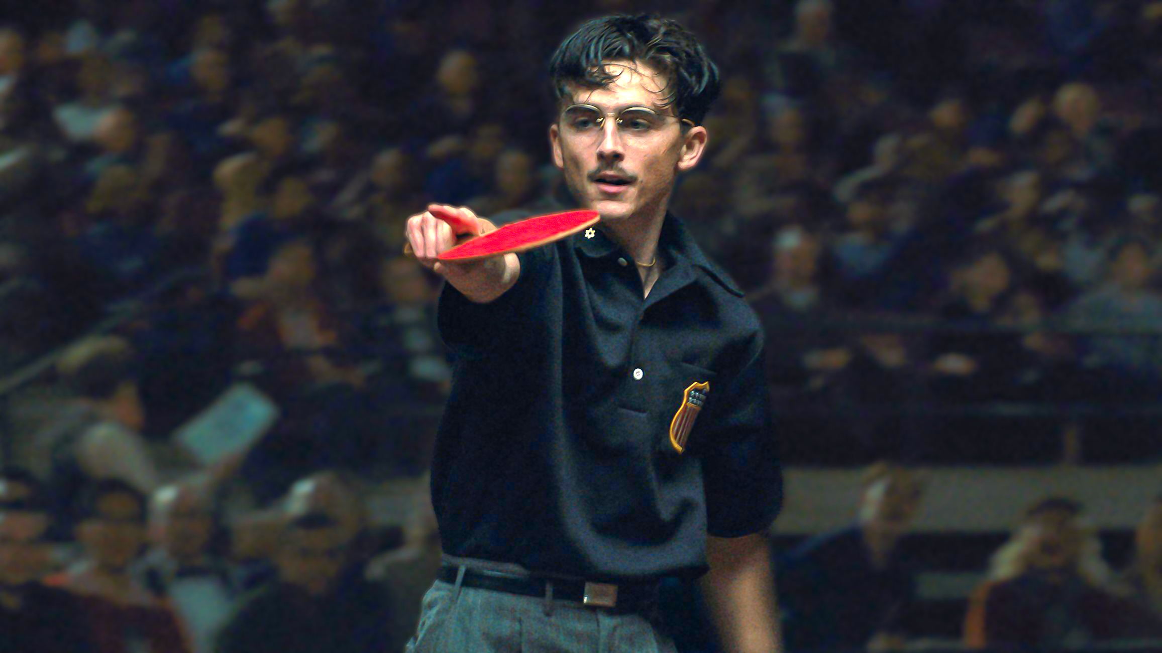 Marty Mauser (Timothée Chalamet) mid-match in a scene from "Marty Supreme"