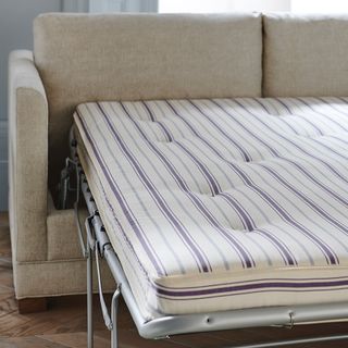 Sofa.com Aissa sofa bed unfolded with striped mattress