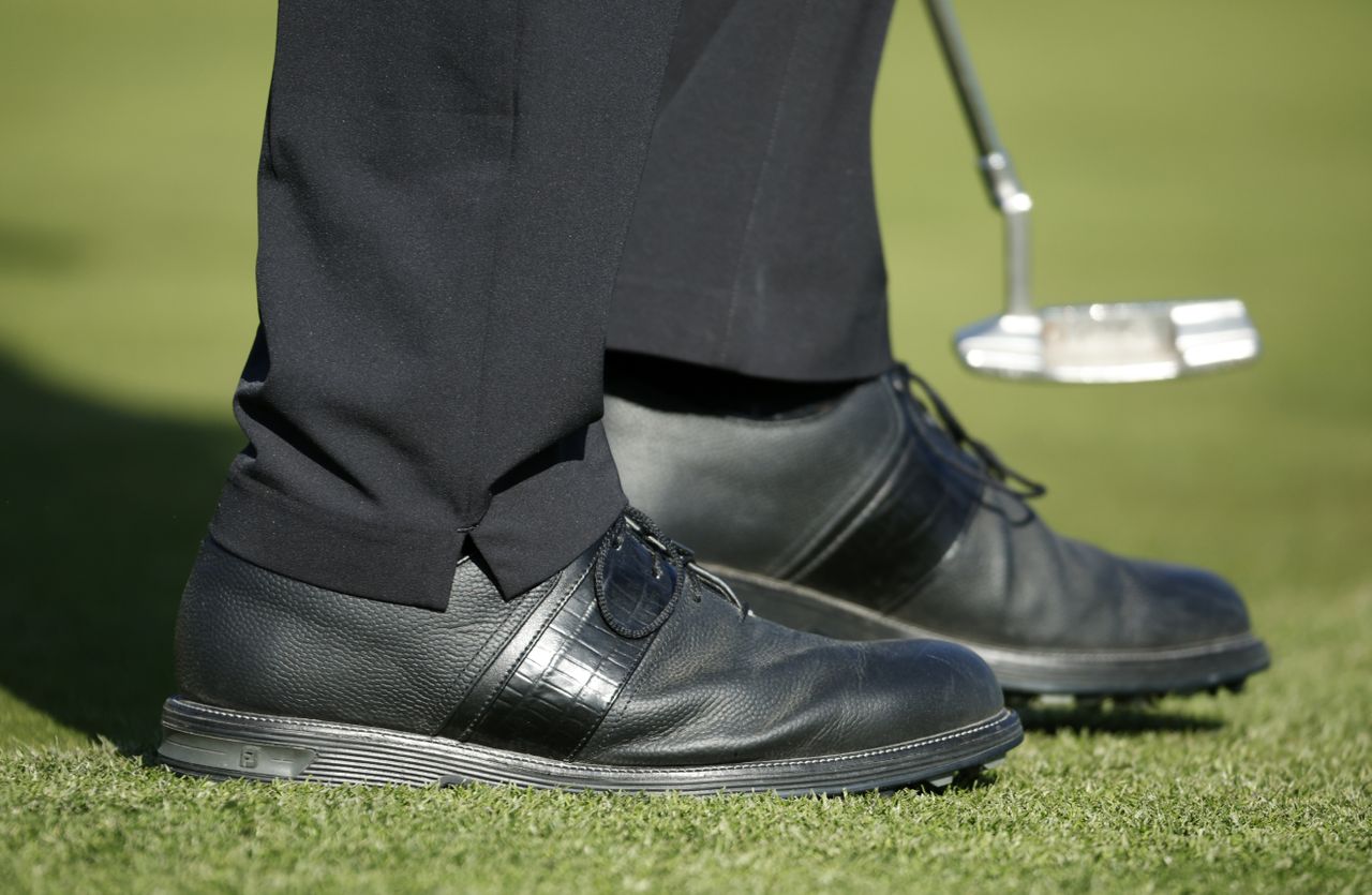 A close up of Tiger Woods' shoes