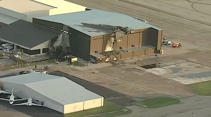 Hole left by plane crash at Dallas-area airport