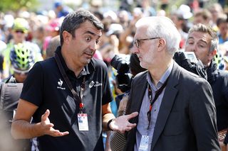 Vuelta director Javier Guillen discusses the race safety situation with UCI president Brian Cookson