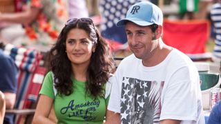 Salma Hayek and Adam Sandler next to each other in Grown Ups