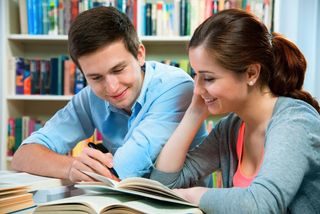 A college-age couple studies together