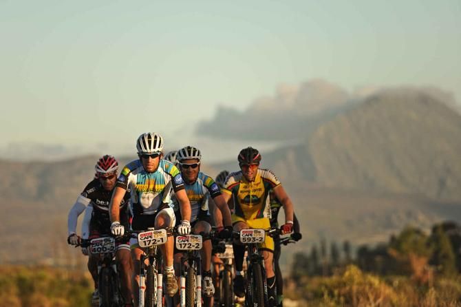Urs Gerig of Team Rawanda Cycling 2 leads a small bunch of riders