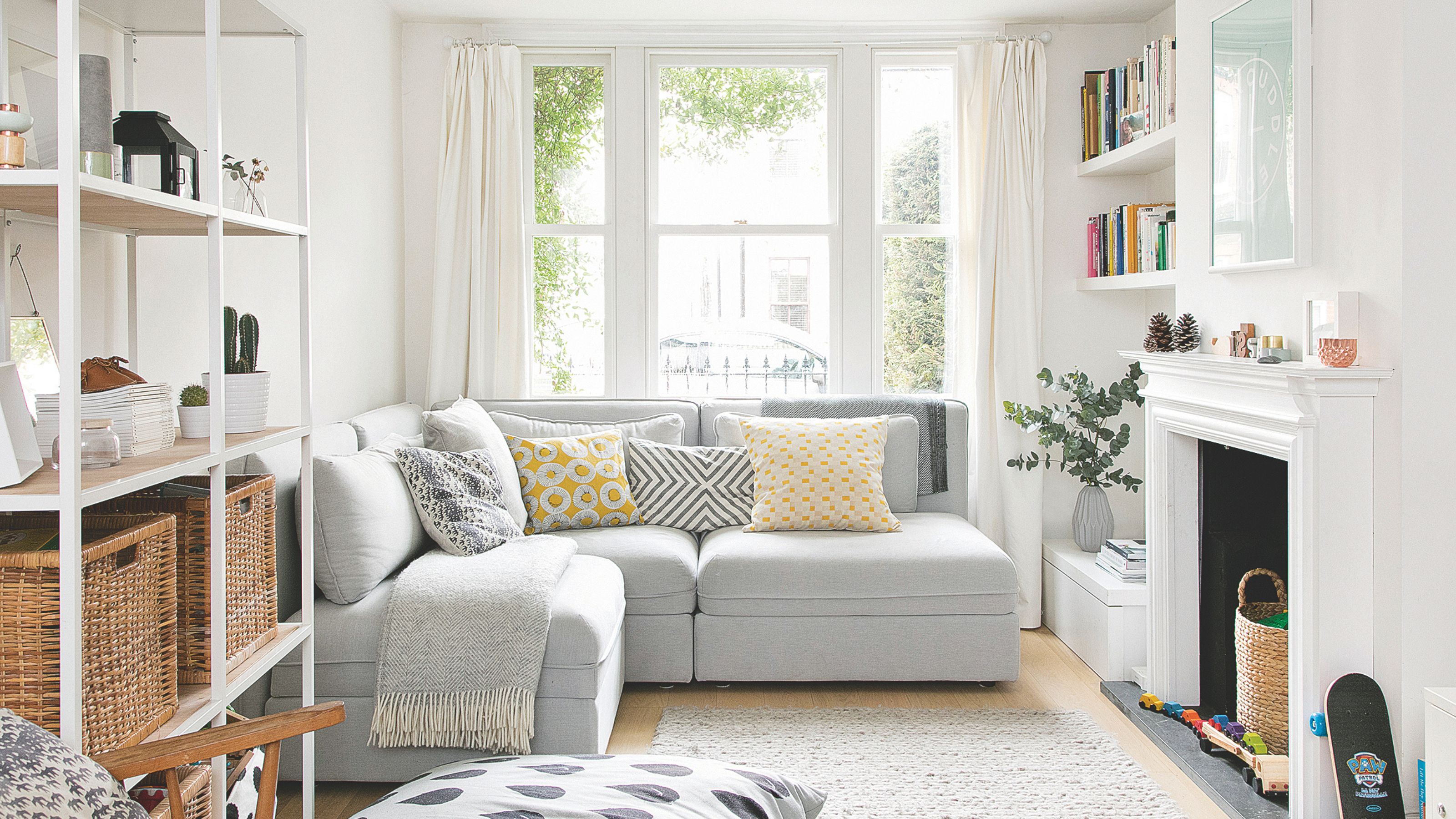 Neutral living room with grey sofa and yellow accent cushions