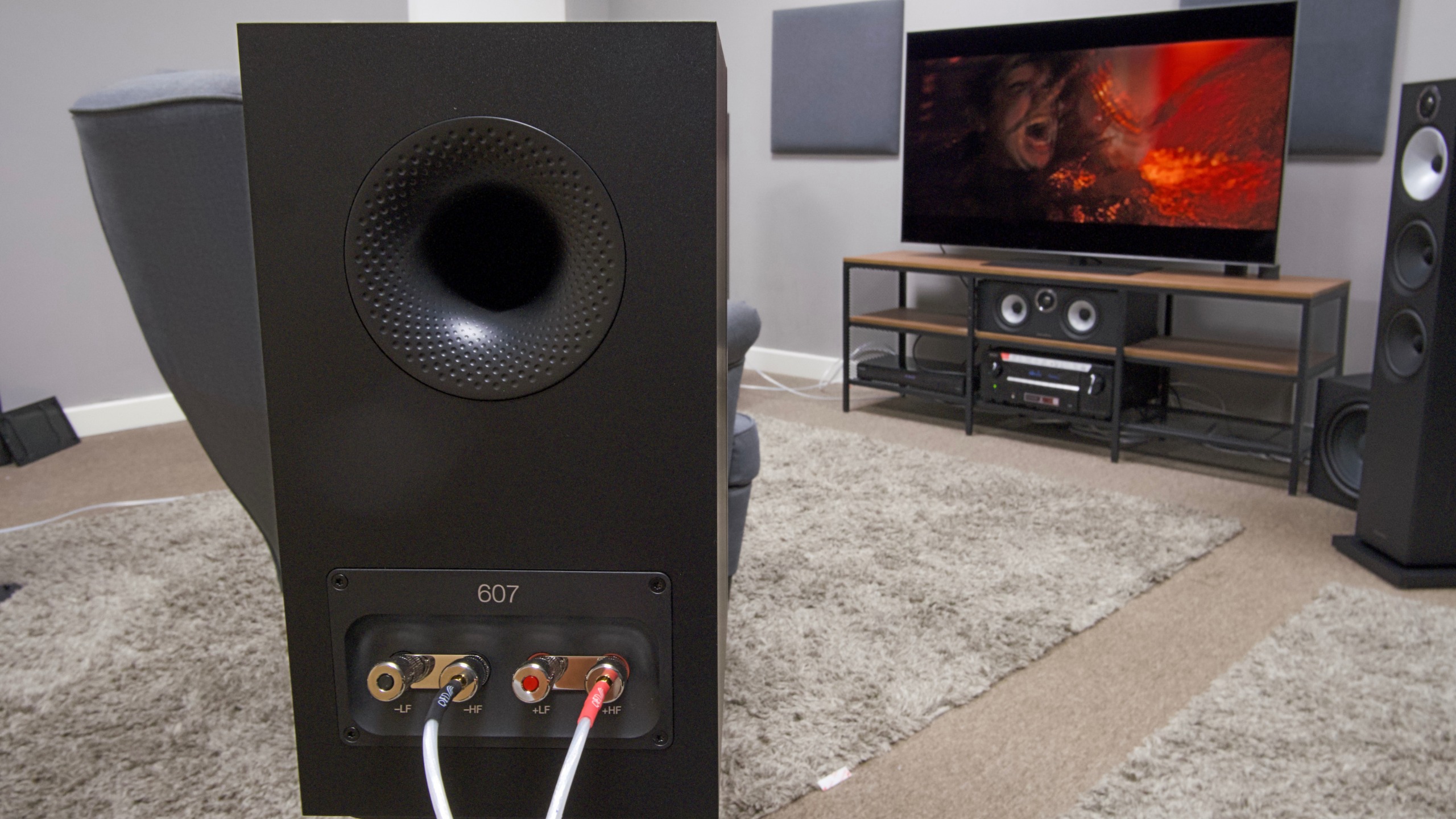 B&amp;amp; W 607 S3 speaker taken from a reverse angle looking at an LG G6 with Alien: Romulus on screen