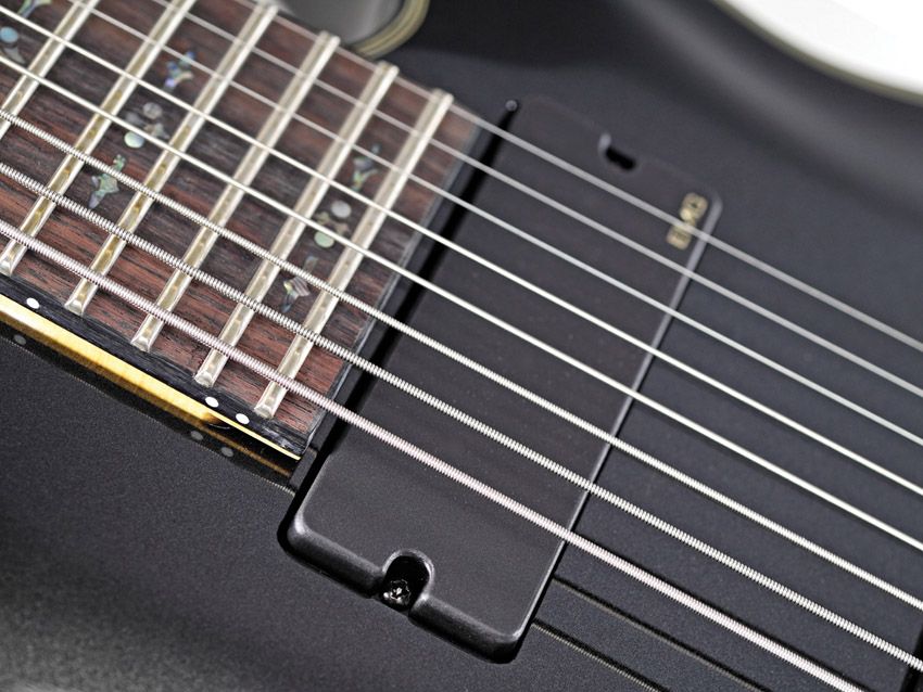 Schecter's Damien Elite 8 breaks eight-string guitars into the mid-price point.