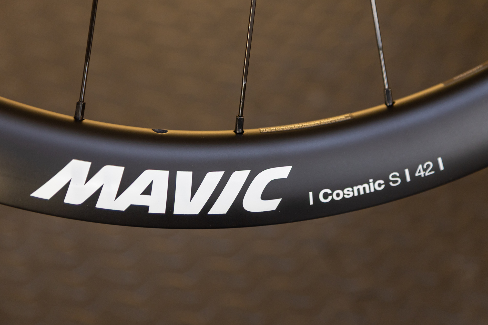 Close up of the Mavic Cosmic S 42 branding on the side of a carbon rim