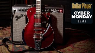 A photo of the Gretsch G6134TFM-NH Nigel Hendroff Signature Penguin leaning against a Fender combo