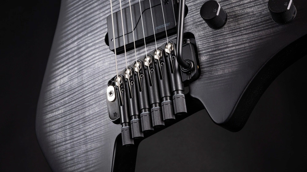 A close-up of the new Arc Tilt tremolo bridge on a Strandberg guitar