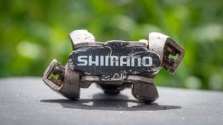 A close up of a Shimano SPD pedal showing dual-sided entry