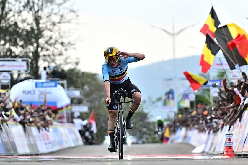 Belgian Remco Evenepoel celebrates counting his victories, the third on the finish line of the Men Elite Individual Time Trial race (40,8km) at the cycling road world championships, in Kigali, Rwanda, Sunday 21 September 2025. The 2025 UCI Road World Championships take place from 21 to 28 September in Kigali, Rwanda.BELGA PHOTO DIRK WAEM (Photo by DIRK WAEM / BELGA MAG / Belga via AFP)