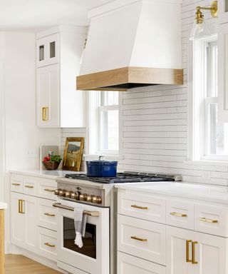 all-white kitchen with gold accents