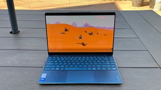 A Lenovo Yoga Slim 9i playing a game