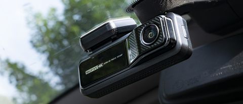 Miofive Dual Dash Cam front camera attached to a windscreen view from low angle