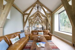 barn conversion living room with picture window for natural light