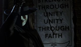 V for Vendetta V puts his hat back on after defacing a poster