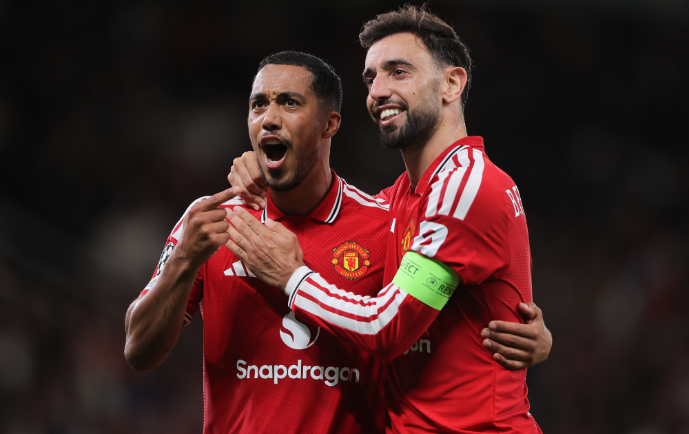 Bruno Fernandes of Manchester United celebrates with teammate Youri Tielemans of Manchester United after scoring their side's second goal during the UEFA Champions League 2026/27 League Phase MD1 match between Manchester United and Sabah FC