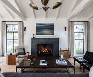 Living room with fire-lit white walls