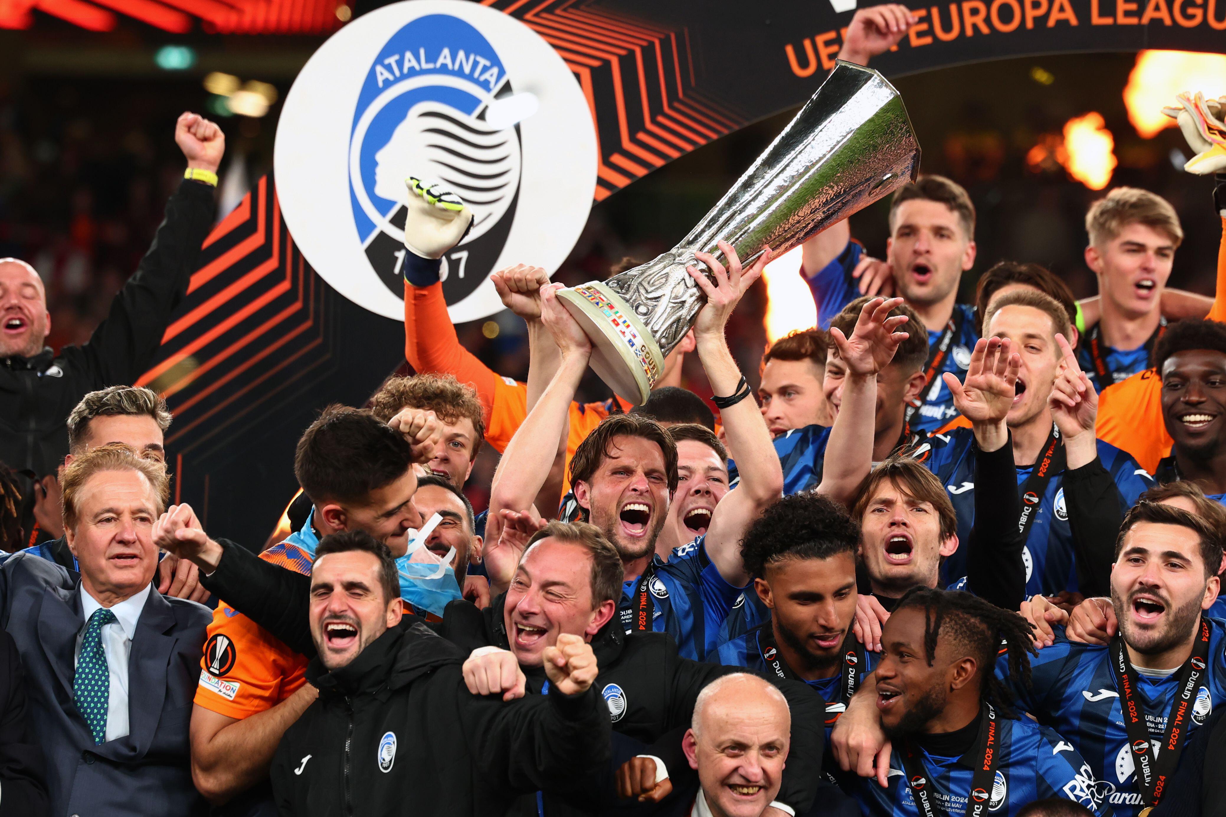 Atalanta celebrate with the trophy after winning the UEFA Europa League final against Bayer Leverkusen at the Aviva Stadium in Dublin in May 2024